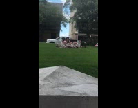 Woman adjusts and takes picture of her merchandise