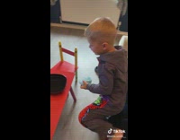 Young boy wash cotton candy in water