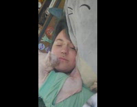 Cat licks and bites owner lip piercing