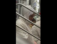 Man with Bra on Head Draws on Paper