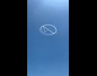 Fantastic Four logo plane contrails on beach sky