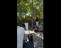 Person wearing leather jumpsuit with horns for photoshoot