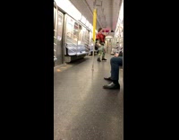 Man on subway talks to himself in the window reflection yells 
