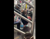 Man sits on the floor and got hair braid in the train