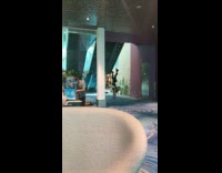 Guy at airport doing handstands over and over again 
