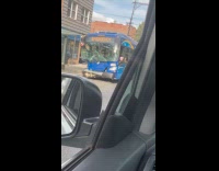 Submitter shows wrecked bus parked on street