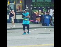 Man with tripod and hula hoop