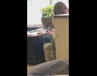 Lady takes photo white cup coffee table 