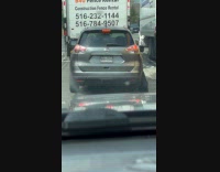 Nissan Rogue Car with blown tire on street