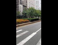 Man yellow hat ride unicycle three wheels