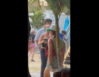 Collab IITW - Woman stripes poses front of large plant