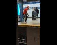 Guy red shirt raps out loud in subway train