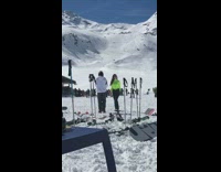 Woman with bright green turtle neck shirt snow picture