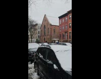 Collab WINY - Giant Head Prop Overlooks from Apartment Window
