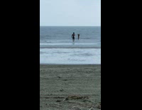 Collab IITW - Woman in bikini dances at the beach while it rains