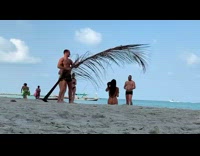 Collab IITW - Woman in bikini poses with a dried coconut leaves at the beach