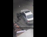 Black jacket hood silver car dances alone