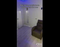 Guy pretends to hold purse for mom