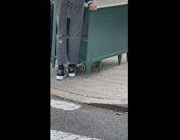 Skater pushes green table on skateboard