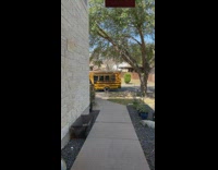 Man picks dog up from school bus