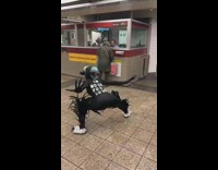 Person in alien costume with mask front and back