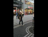 Black skirt girl poses outside sephora store 