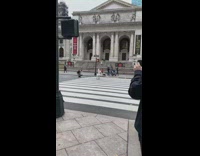 Woman white outfit sit pedestrian lane windy