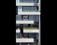 Two men tiktok dance on the balcony