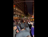 Crowd parties on the street for Halloween