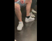 Guy sits with feet facing out 