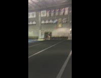 Black shirt girl flips indoor gym fail 