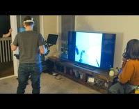 Guy plays VR game punches TV