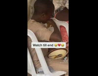 Boy stops eating after catching camera 