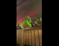 Man green mask crop top at a party