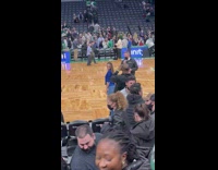 Woman blue shirt side pose basketball court