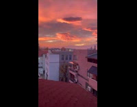 Sunset view on the sky from window