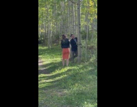 Guy suit jacket ribbon pose beside tree