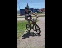 Guy attempts wheelie on bicycle falls fail 