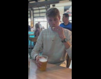 Guy drinks cup of beer in one gulp
