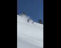 Guy falls off snowmobile flips down mountain 