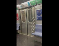 Guy carries a television screen on subway 