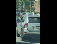 Driver puts leg on side mirror 