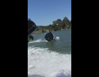 Guy holds onto green float flips boat