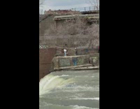 Two girls photo shoot large water dam