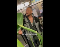 Man sings to banana plant inside train