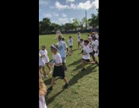 Kids form conga line white shirt camp 