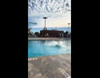 Large man jumps and dive in pool