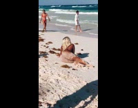 Blonde girl lay beach butt with sand