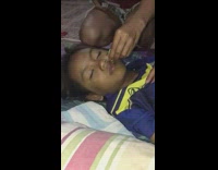 Kid squeezes lime over sleeping girl 