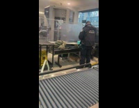 Xray of a firearm in suitcase at the airport security screening 
